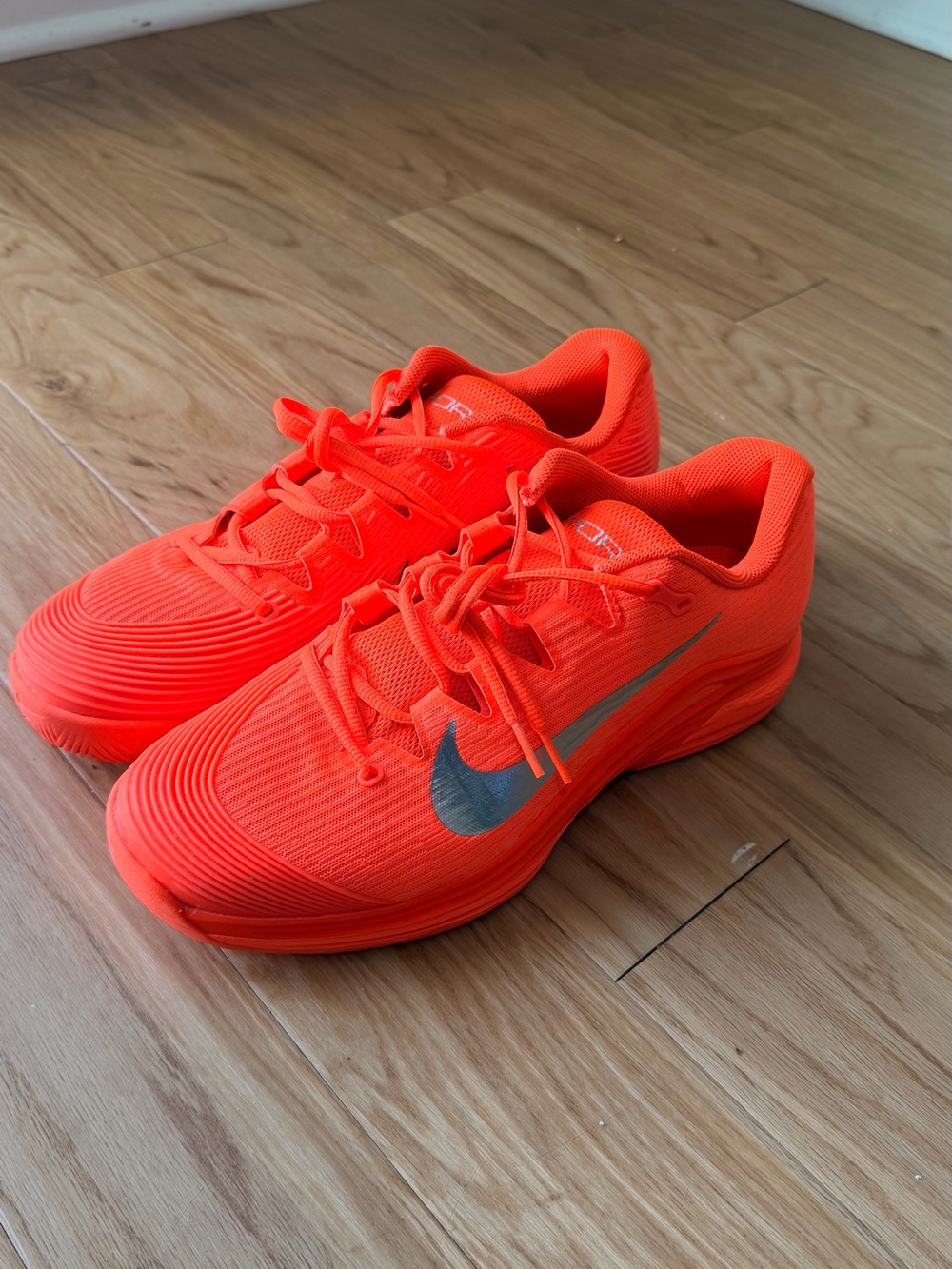 Nike men’s Neon Orange Sneakers with Silver Swoosh